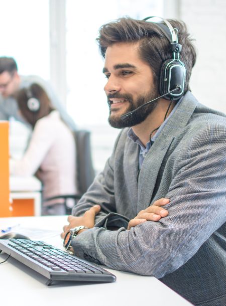 Get in touch with our support team today Customer support representative assisting client via phone and email